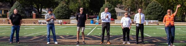 NWU alumni athletes on the football field being honored.